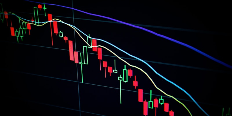 Stock market trading floor with digital displays showing financial data