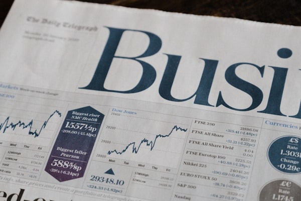 Person starting investment journey with laptop and charts